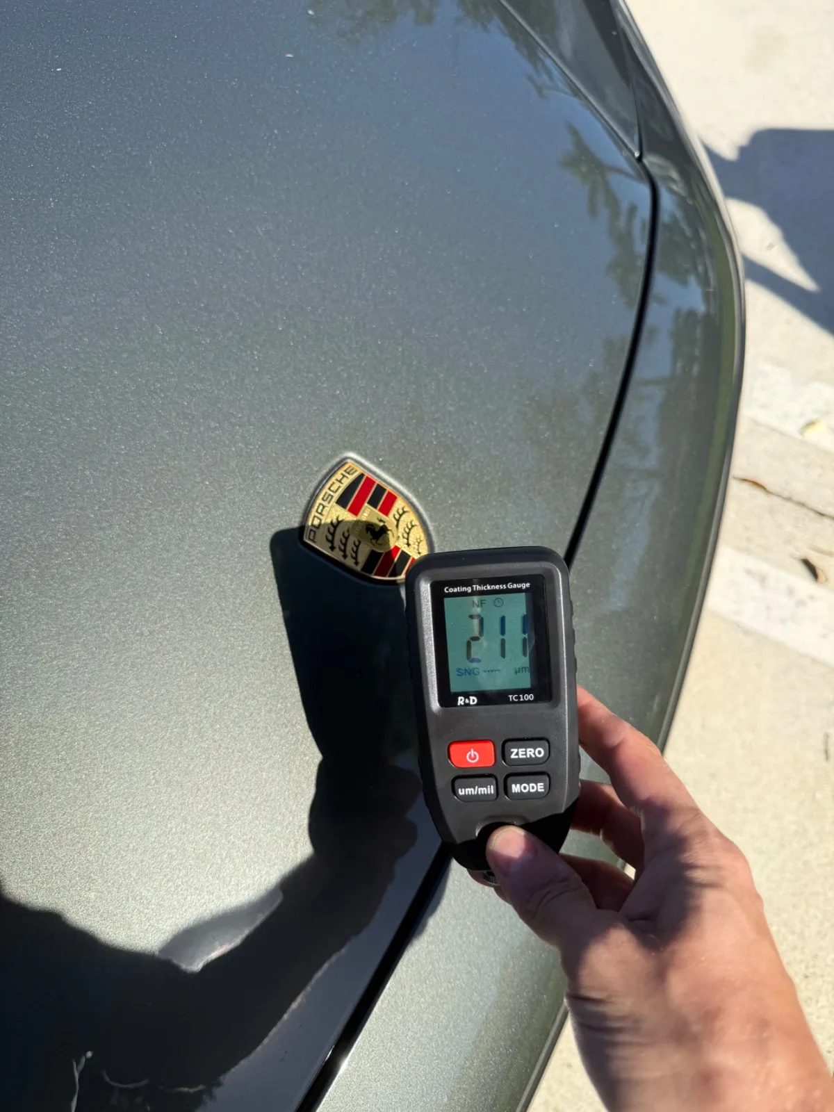 Paint gauge on the repaired front fender of the Porsche 911